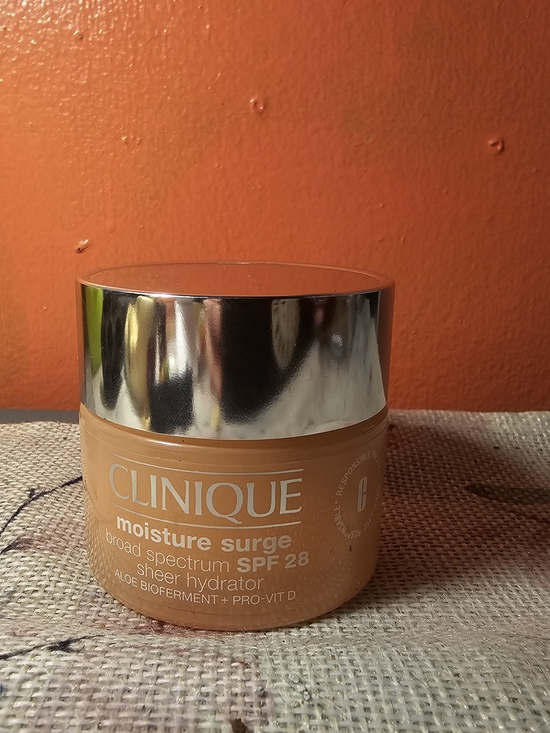 Clinique Other - Clinique Moisture Surge Sheer Hydrator in Orange Jar with Silver Cap